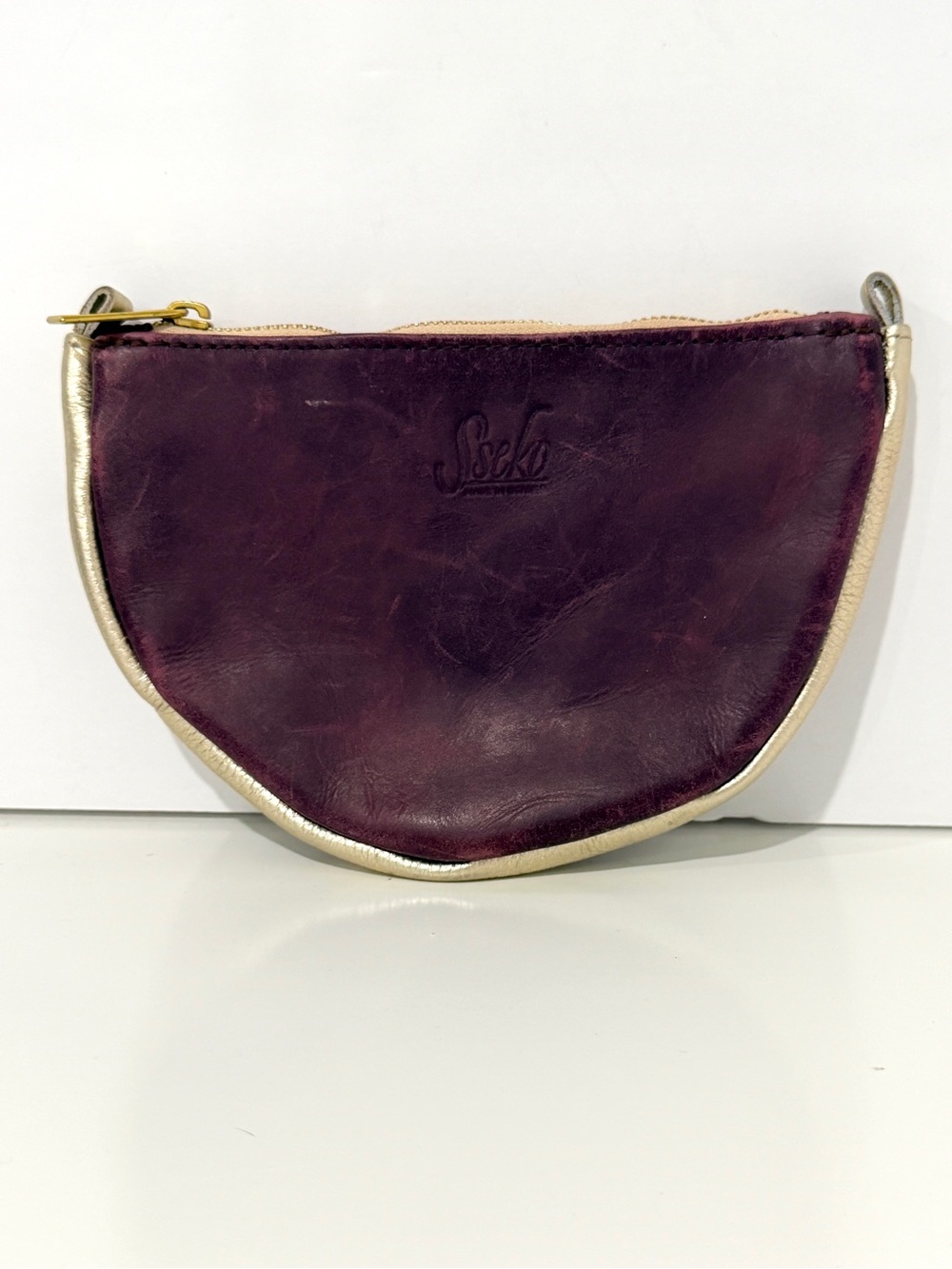SSEKO Plum Leather Half-Moon Clutch with Gold Trim